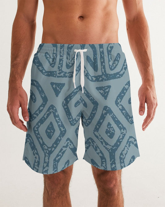 Men's Teal Tribal Cloth Swim Trunks — bold all-over print by AmbiVirile, front view