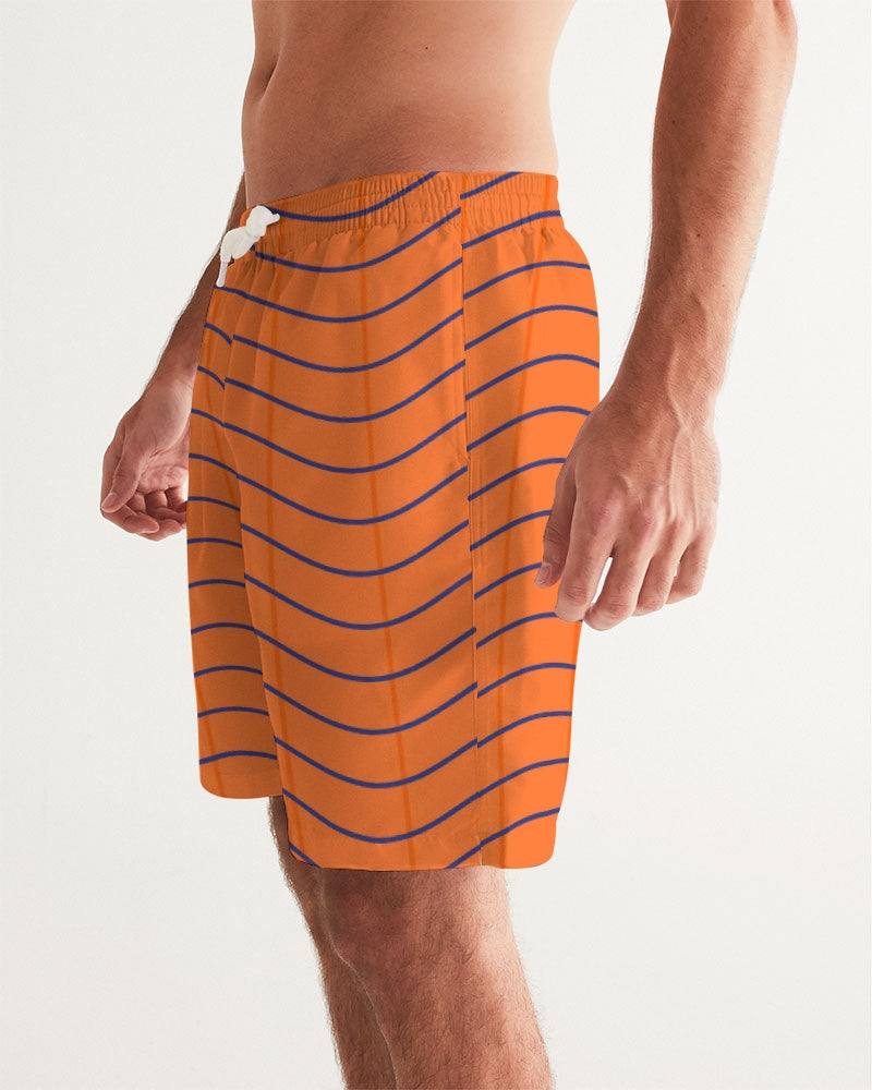 Men's Pumpkin Swim Trunks — bold all-over print by AmbiVirile, side view