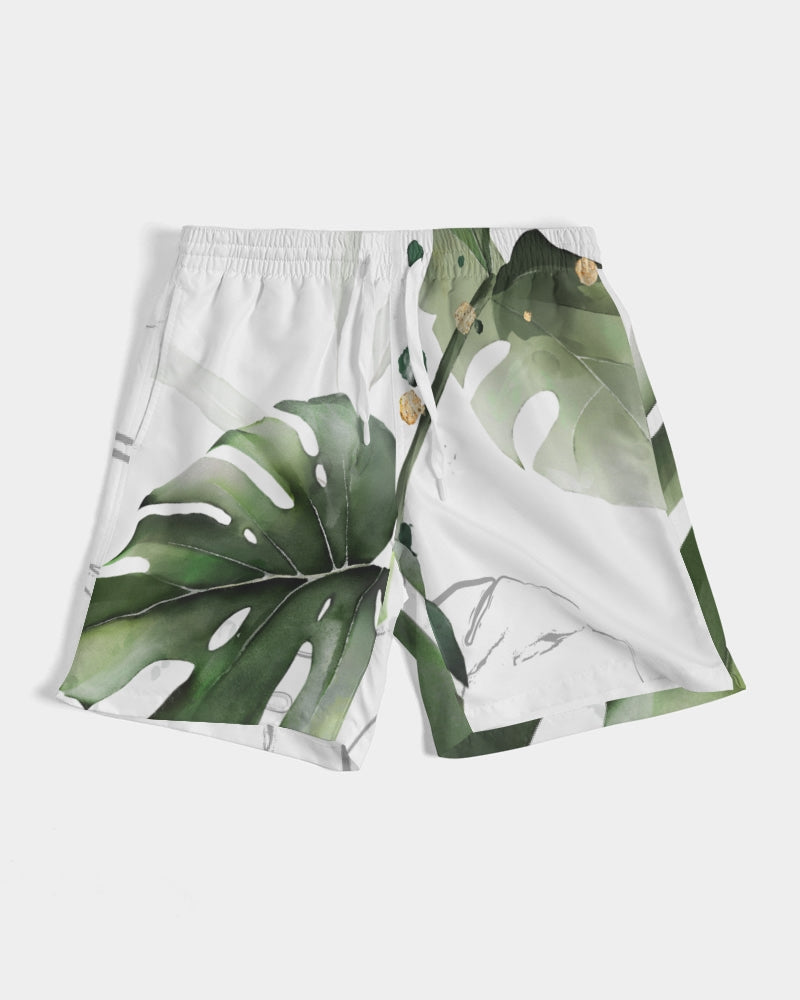 Men's Monstera Swim Trunks — bold all-over print by AmbiVirile, front view