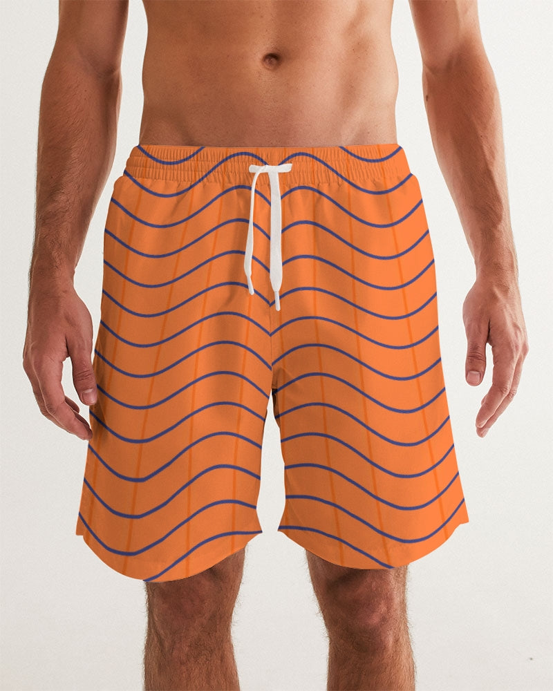 Men's Pumpkin Swim Trunks — bold all-over print by AmbiVirile, front view