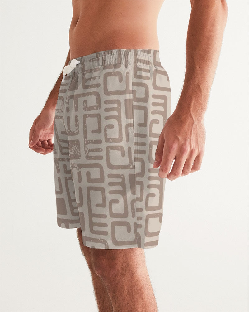 Men's Beige Tribes Swim Trunks — bold all-over print by AmbiVirile, side view