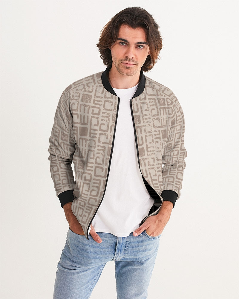 Men's Beige Tribes Bomber Jacket — bold all-over print by AmbiVirile, front view